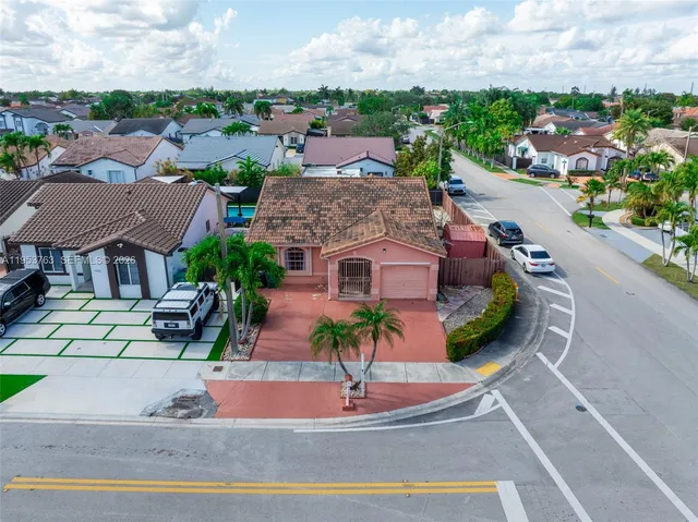 an aerial view of multiple houses with outdoor space
