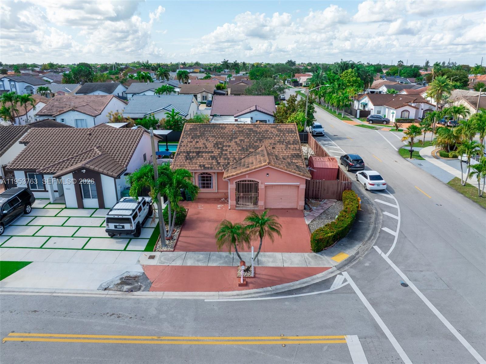 1002 Southwest 142nd Court Miami, FL 33184 - Photo 38 of 50 a aerial view of a house with a garden and plants