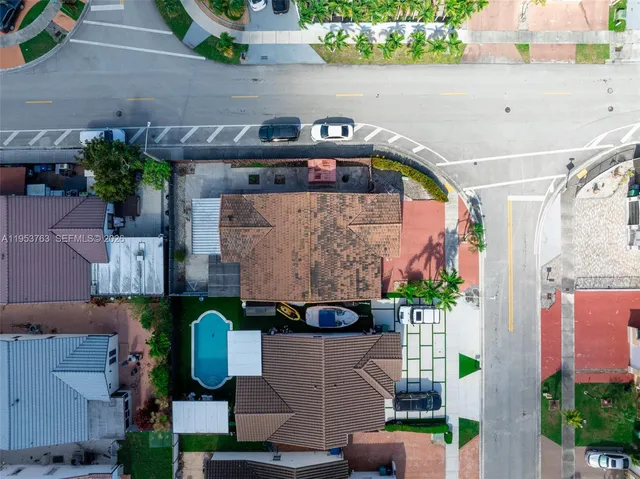 a backyard of a house with seating space and trees