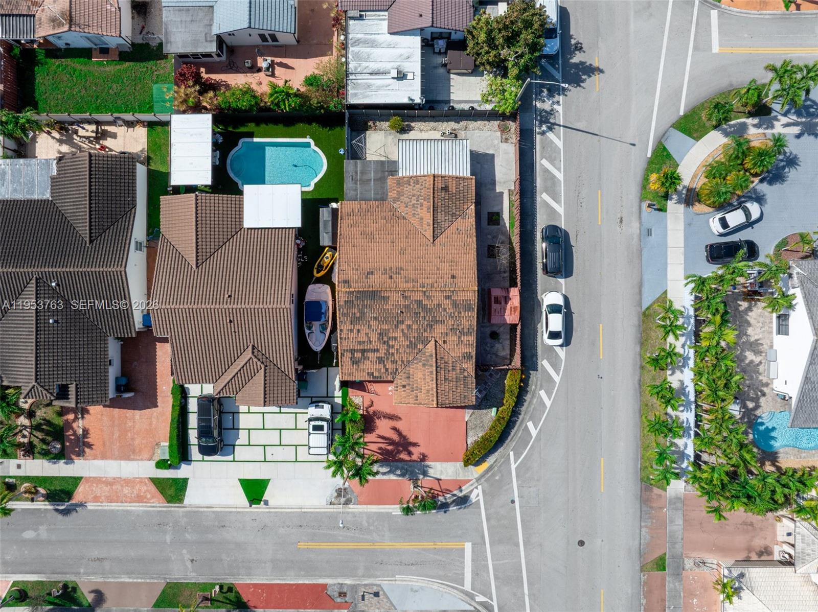 1002 Southwest 142nd Court Miami, FL 33184 - Photo 42 of 50 an aerial view of a house with a yard and garden