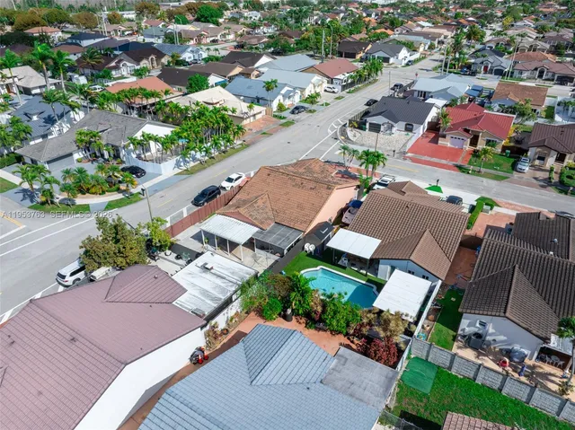 an aerial view of a city with streets and houses
