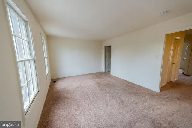 an empty room with windows