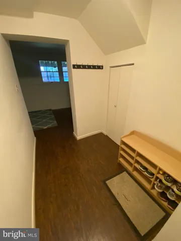 an empty room with wooden floor
