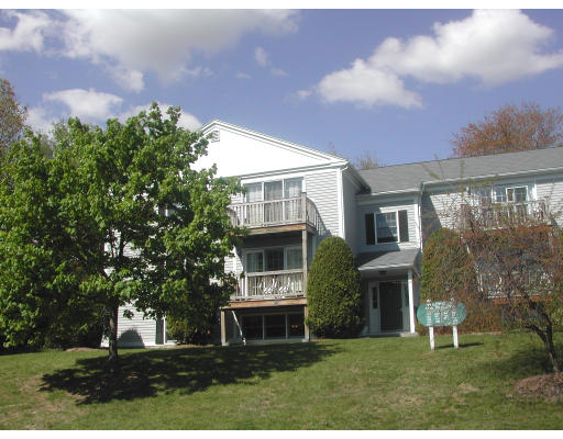 48 Evergreen Road, Unit A101 Northampton, MA 01053 - Photo 1 of 5 a front view of house with yard and green space