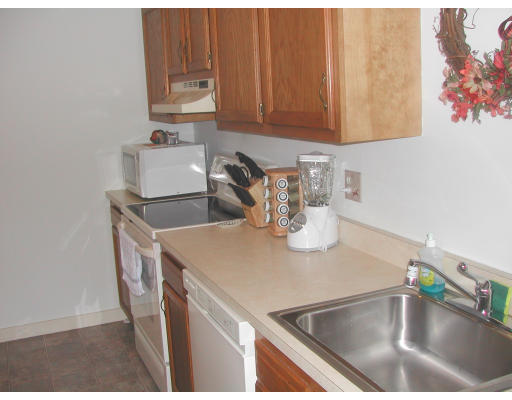 48 Evergreen Road, Unit A101 Northampton, MA 01053 - Photo 3 of 5 a kitchen with a sink and cabinets