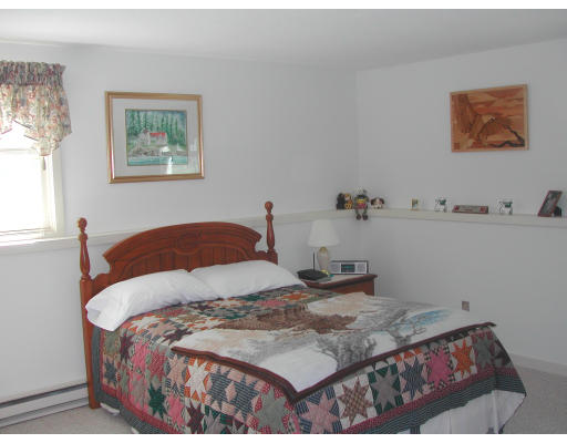48 Evergreen Road, Unit A101 Northampton, MA 01053 - Photo 5 of 5 a bedroom with a bed and a cabinets
