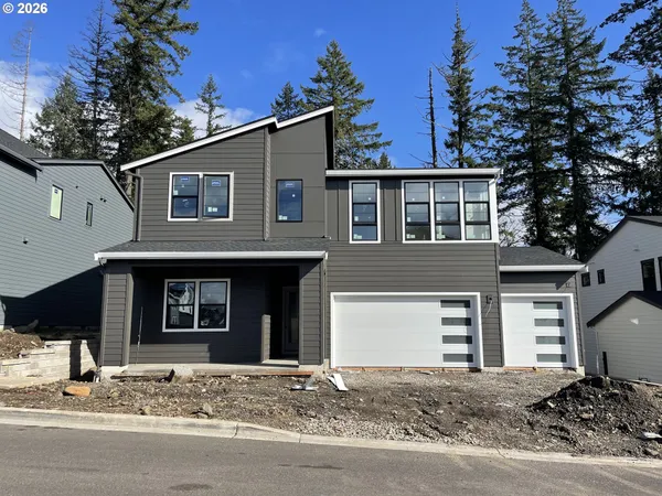 a front view of a house with a garage