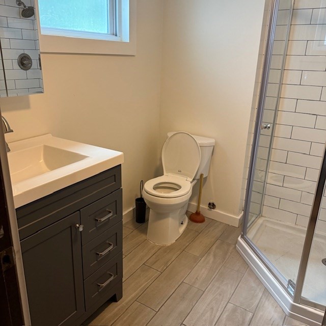 254 Rice Avenue, Unit 1 Northborough, MA 01532 - Photo 5 of 9 a bathroom with a sink and a toilet