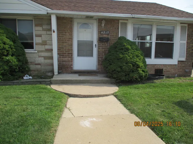 front view of house with a yard