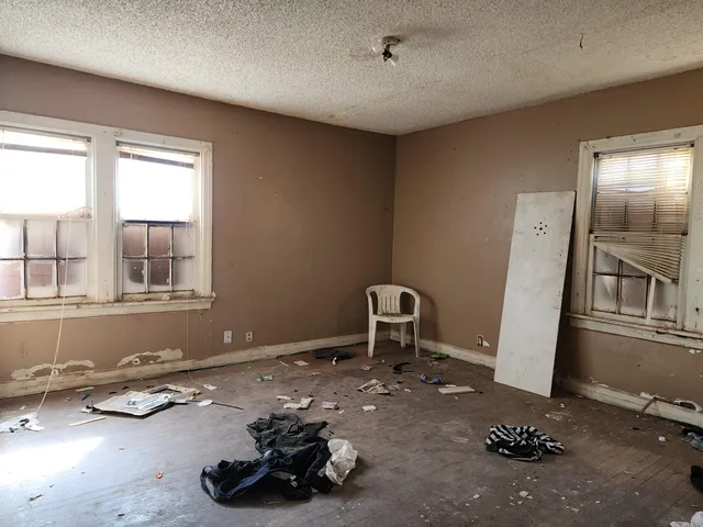 a black and white photo of a fireplace