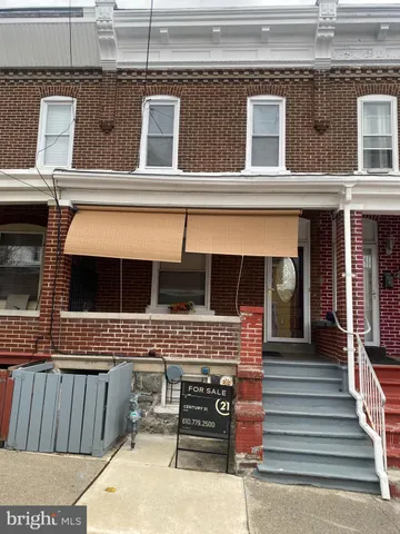 a view of a patio with table and chairs with wooden floor and fence