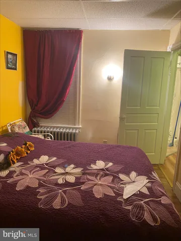 a room with water heater and a table