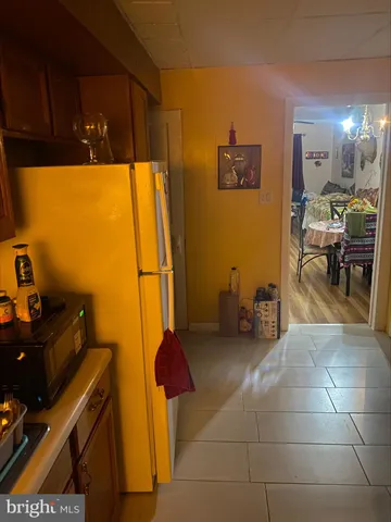 a room with furniture a dining table and a sink