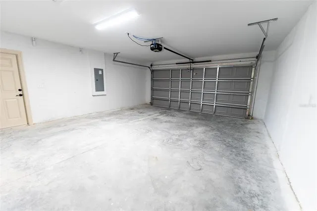 a view of an empty room with a staircase