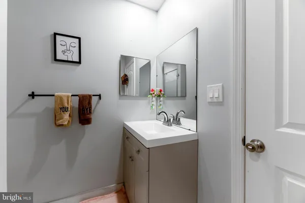 a bathroom with a sink and mirror