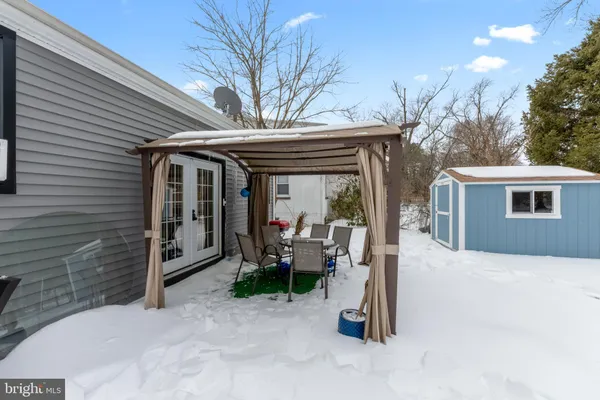 a view of a house with a outdoor seating area