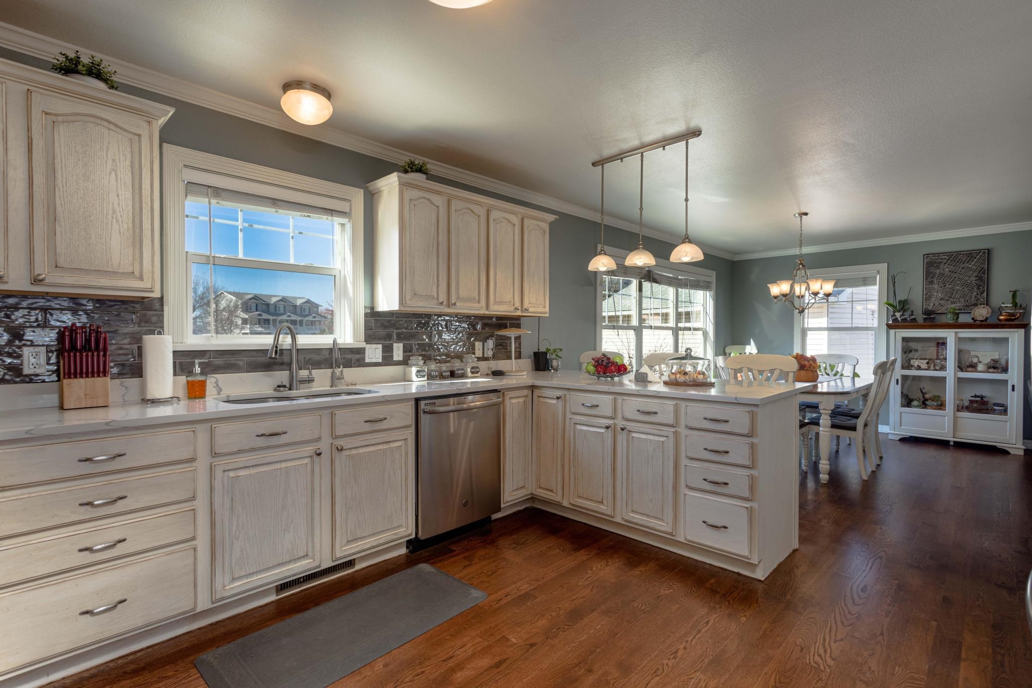 1168 Windsor Park Drive Fruita, CO 81521 - Photo 15 of 41 a kitchen with sink cabinets and window