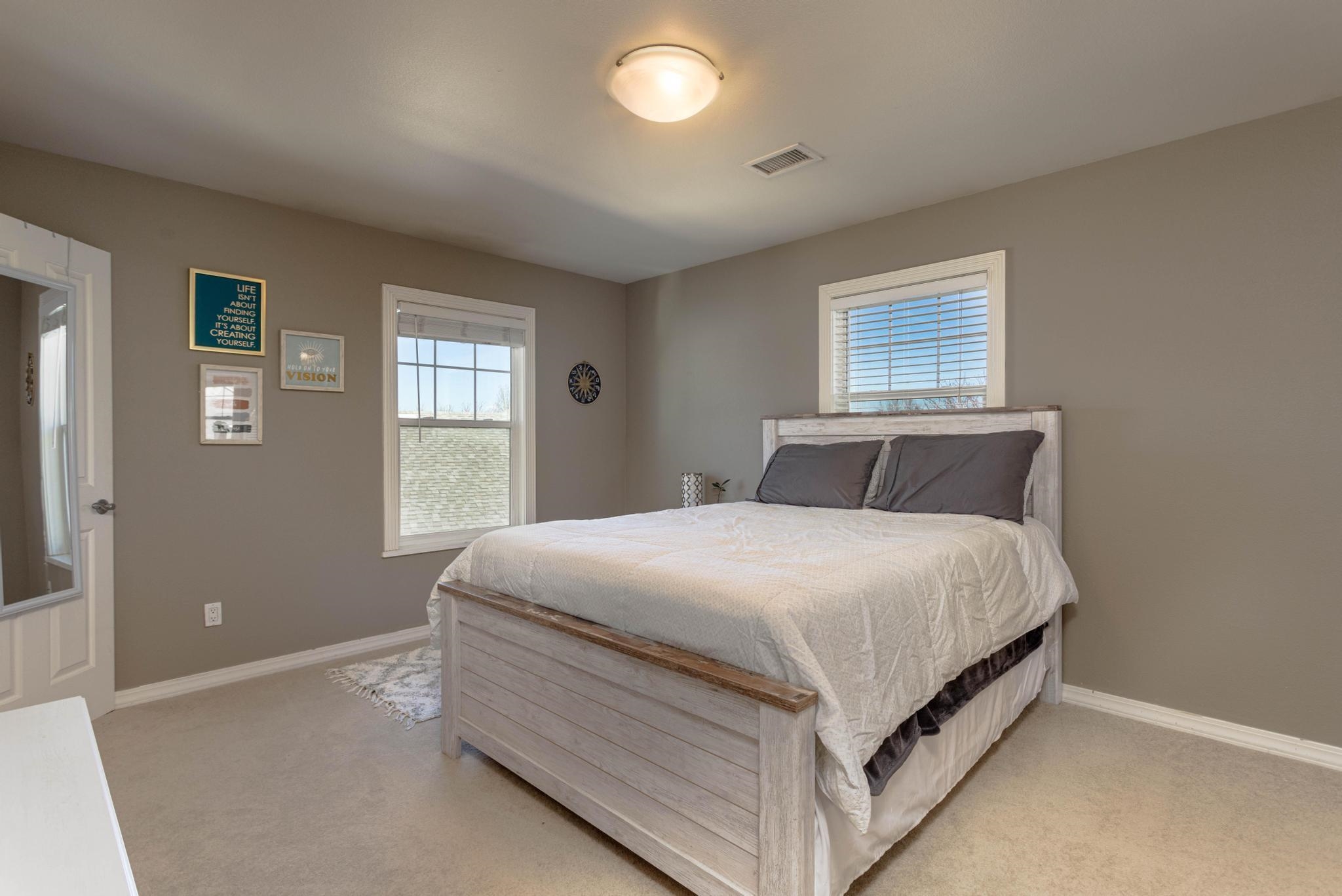 1168 Windsor Park Drive Fruita, CO 81521 - Photo 19 of 41 a bedroom with a bed and window