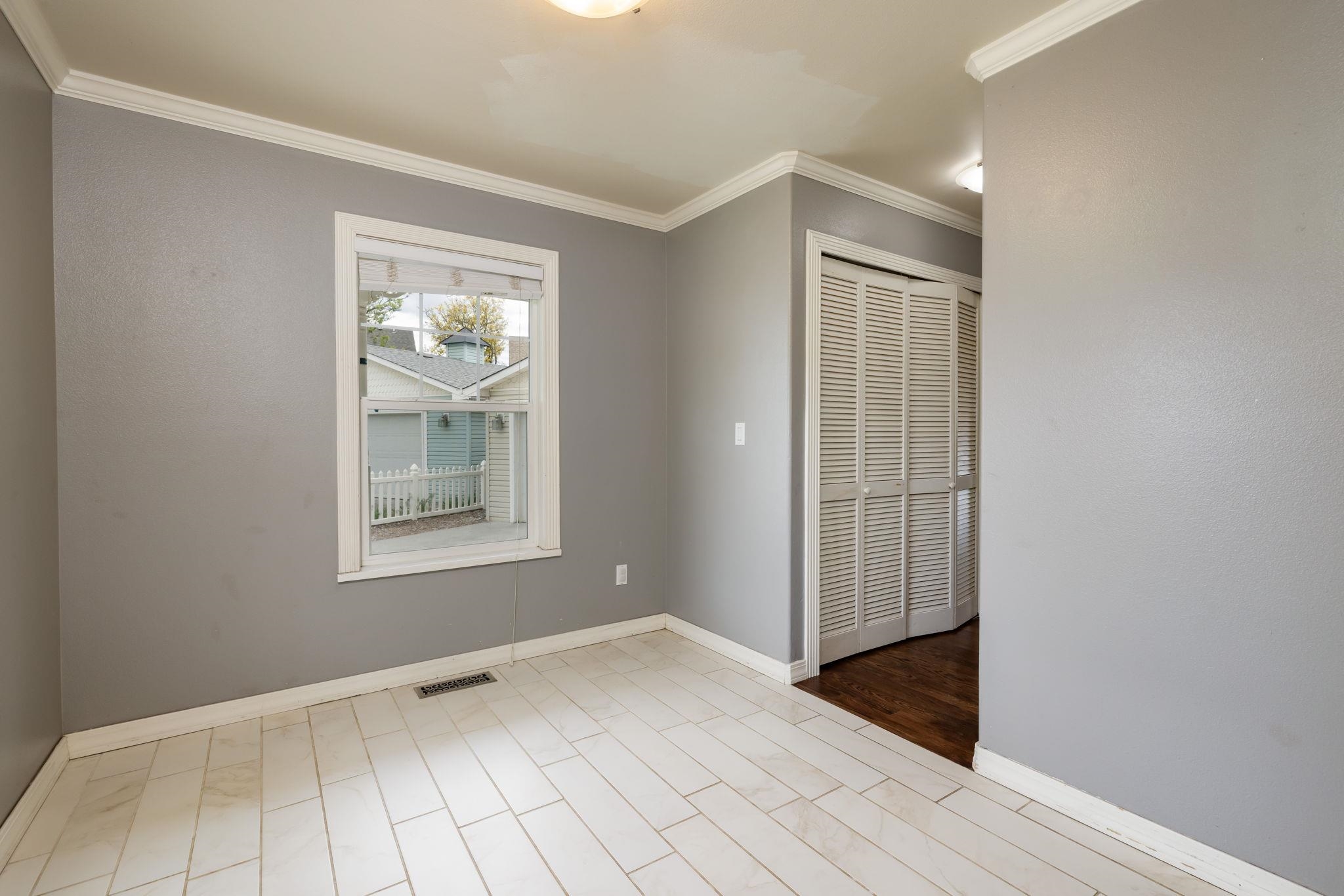 1168 Windsor Park Drive Fruita, CO 81521 - Photo 22 of 41 an empty room with wooden floor and windows