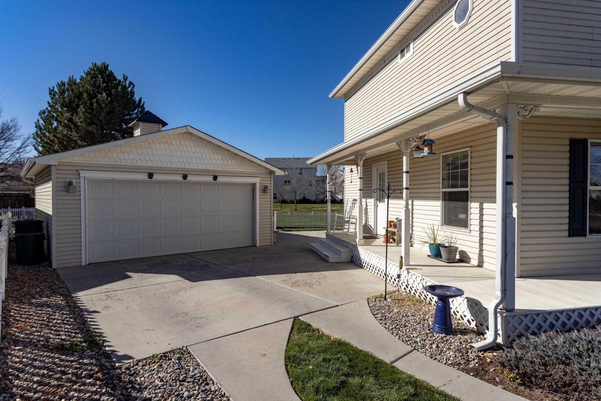 1168 Windsor Park Drive Fruita, CO 81521 - Photo 3 of 41 a front view of a house with a yard