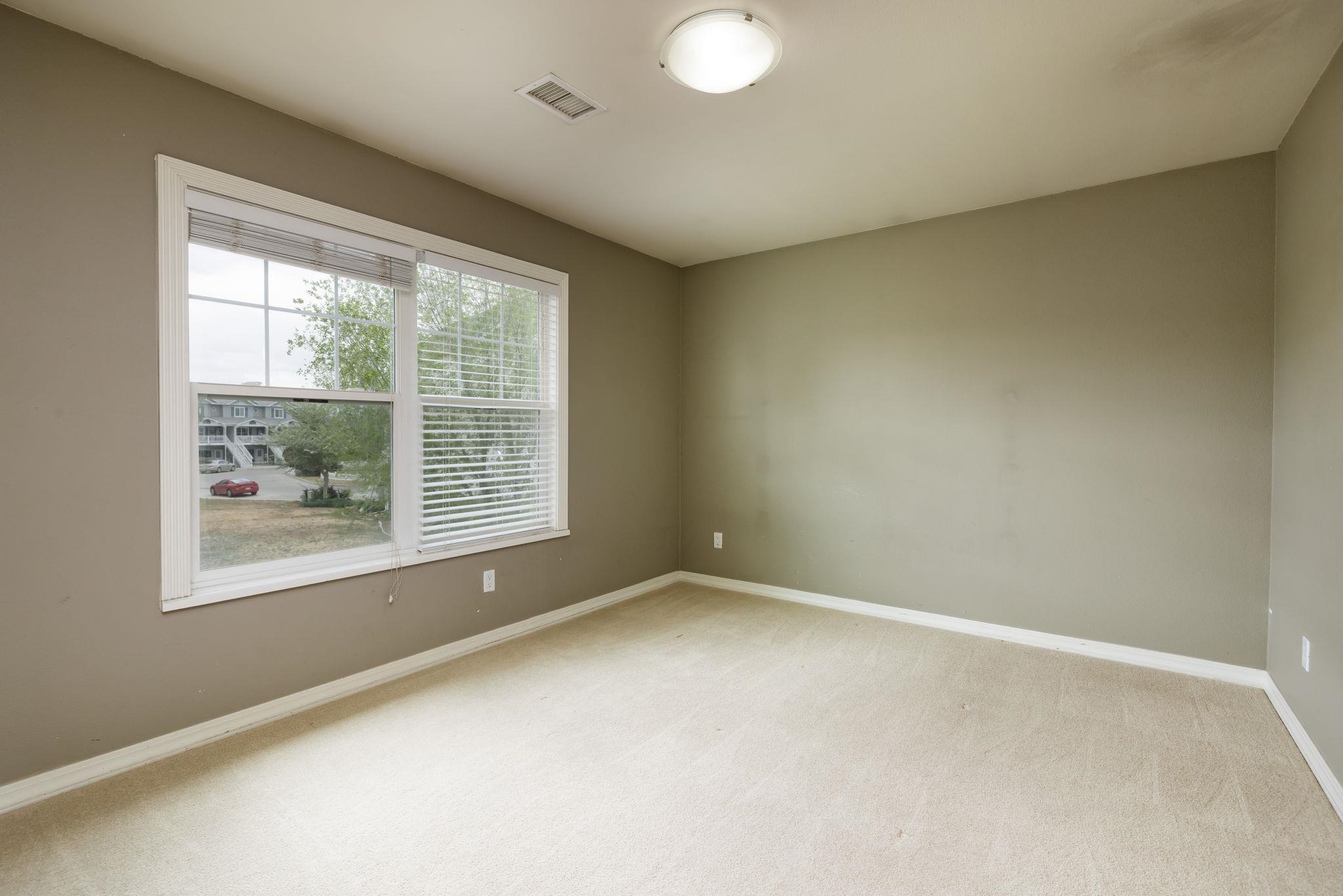 1168 Windsor Park Drive Fruita, CO 81521 - Photo 31 of 41 an empty room with windows