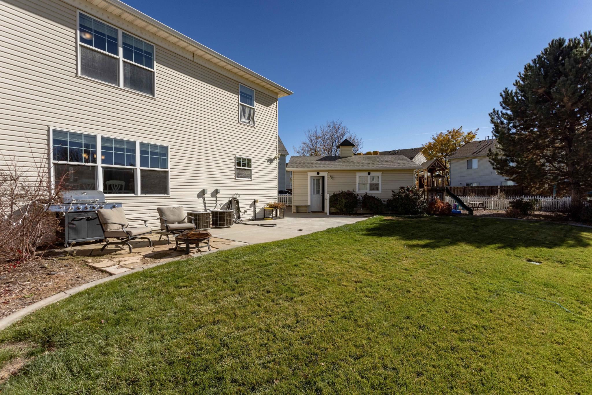 1168 Windsor Park Drive Fruita, CO 81521 - Photo 5 of 41 a view of a house with swimming pool and sitting area