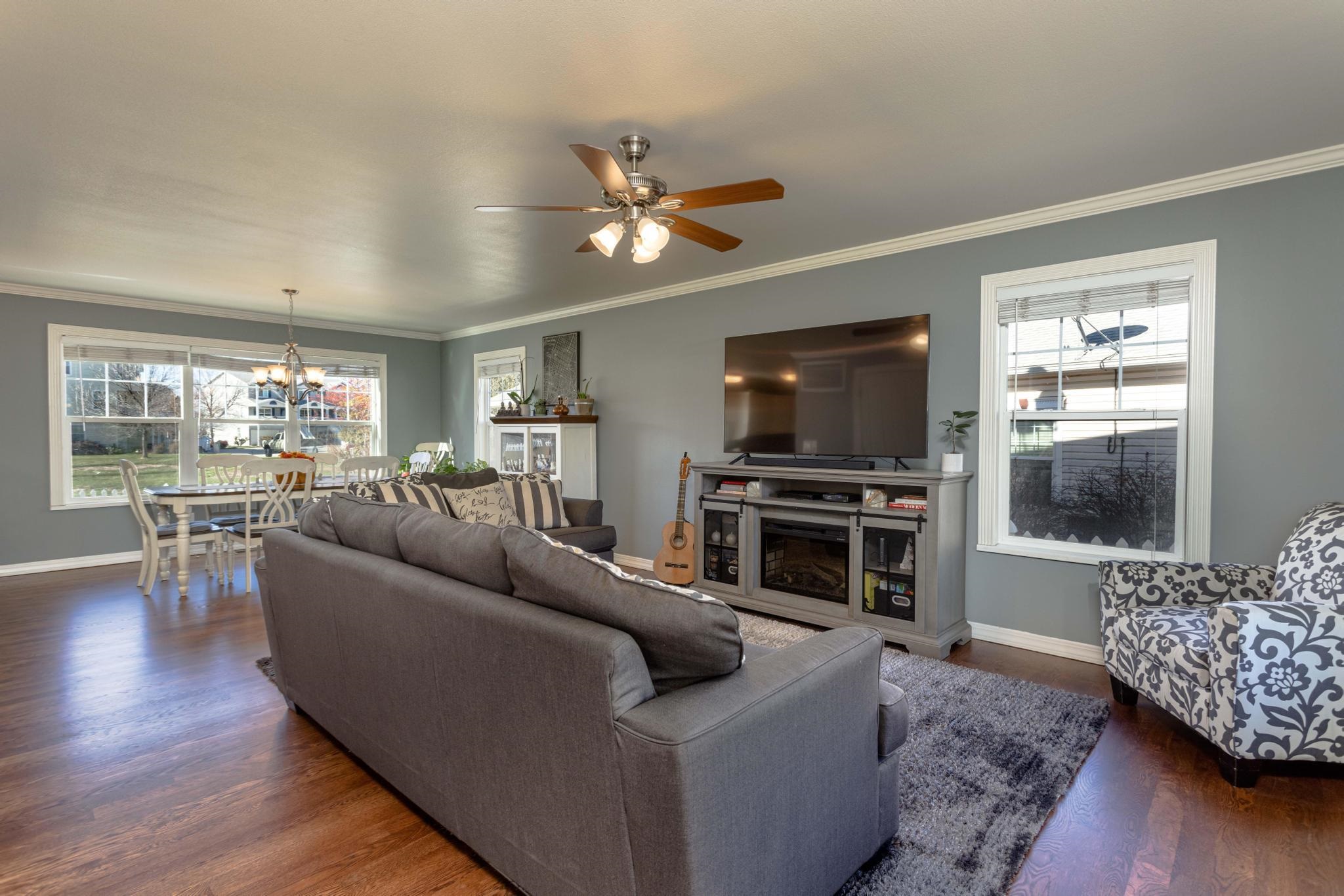 1168 Windsor Park Drive Fruita, CO 81521 - Photo 6 of 41 a living room with furniture and a flat screen tv