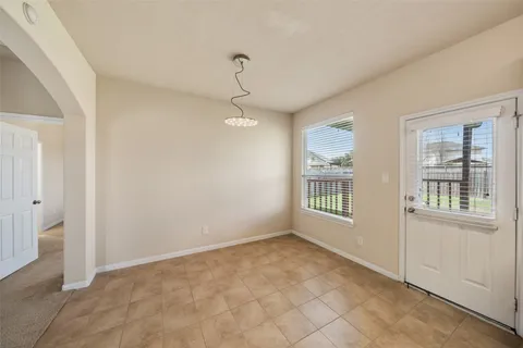 a spacious bathroom with a double vanity sink mirror and shower