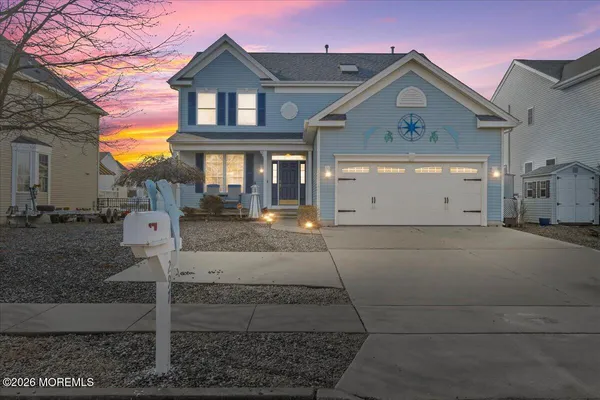 a front view of a house with garage