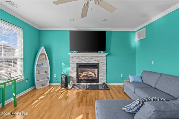 a living room with furniture and a fireplace