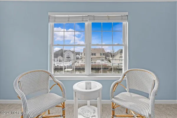 a living room with furniture a table and chairs
