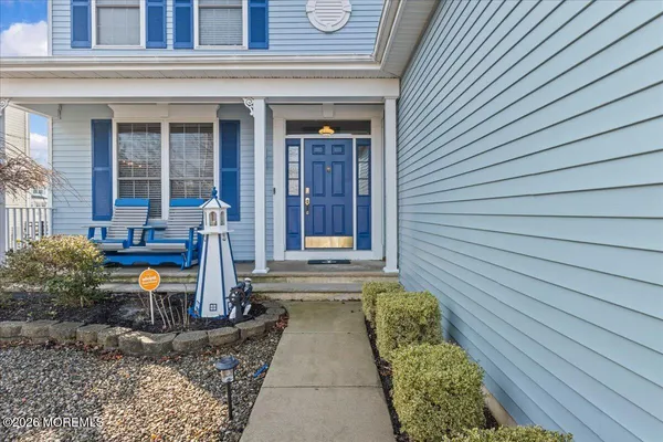front view of a house with a chairs