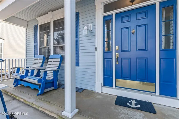 a view of front door of house with stairs