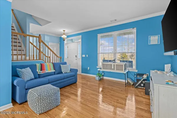 a living room with furniture and a window