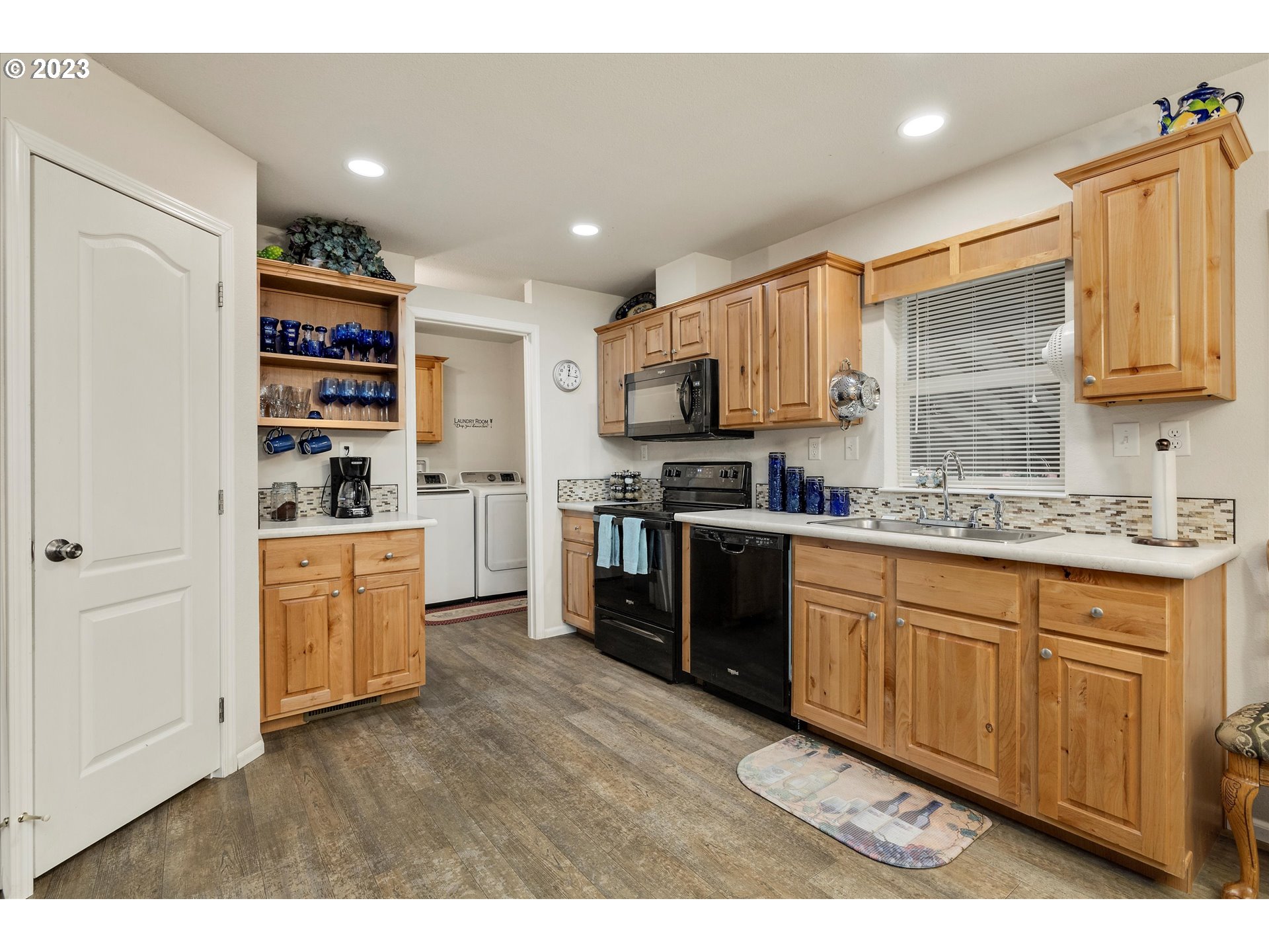 25222 East Welches Road, Unit 46 Welches, OR 97067 - Photo 11 of 30 a kitchen with granite countertop a refrigerator stove top oven and sink