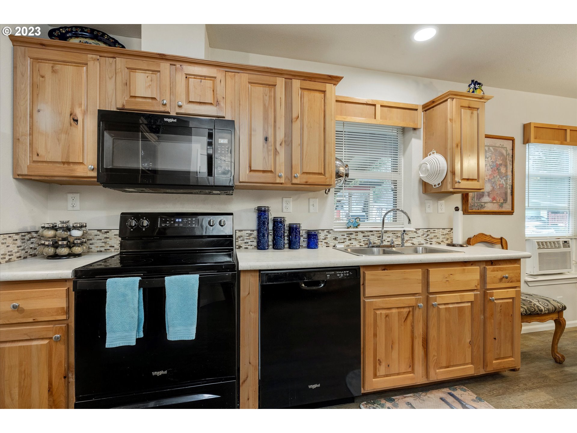 25222 East Welches Road, Unit 46 Welches, OR 97067 - Photo 14 of 30 a kitchen with stainless steel appliances granite countertop a sink stove and cabinets