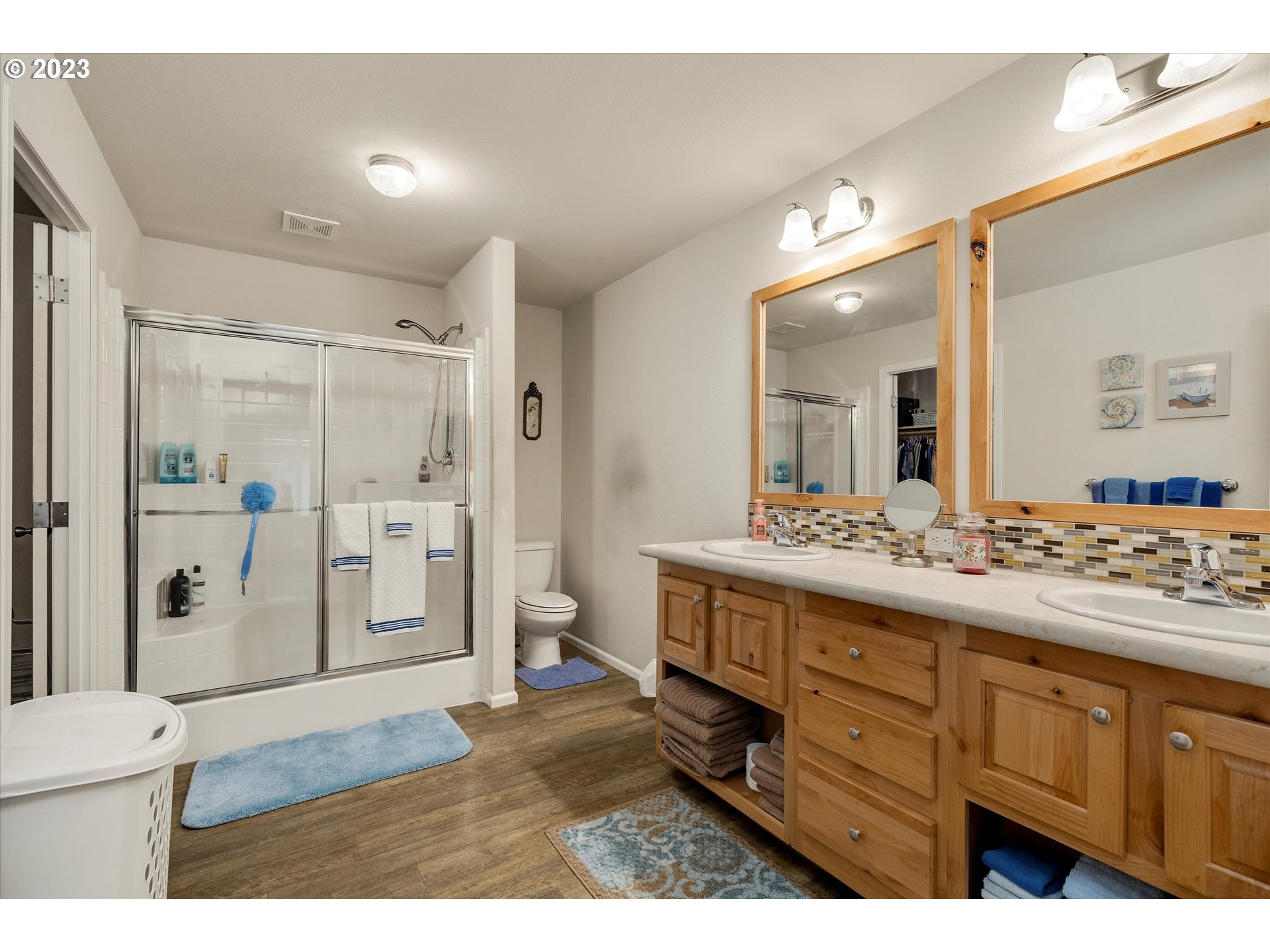 25222 East Welches Road, Unit 46 Welches, OR 97067 - Photo 17 of 30 a bathroom with a granite countertop sink mirror and shower