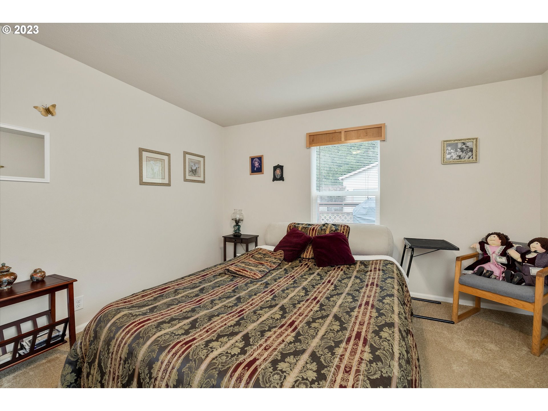 25222 East Welches Road, Unit 46 Welches, OR 97067 - Photo 20 of 30 a bedroom with a bed and glass windows