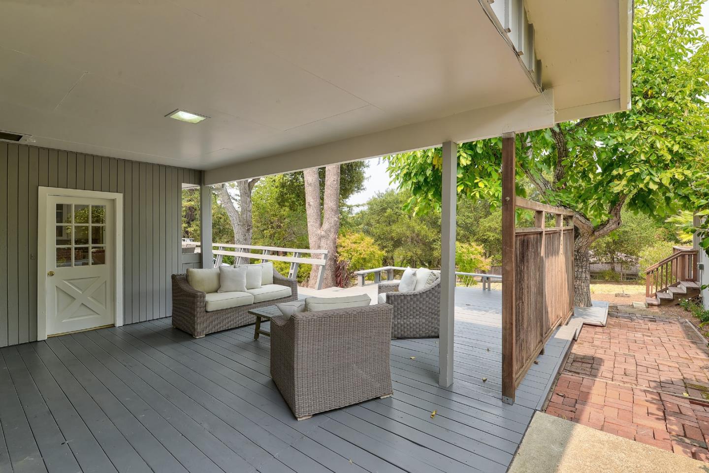 148 Bardet Road Woodside, CA 94062 - Photo 23 of 39 a living room with furniture and a large window