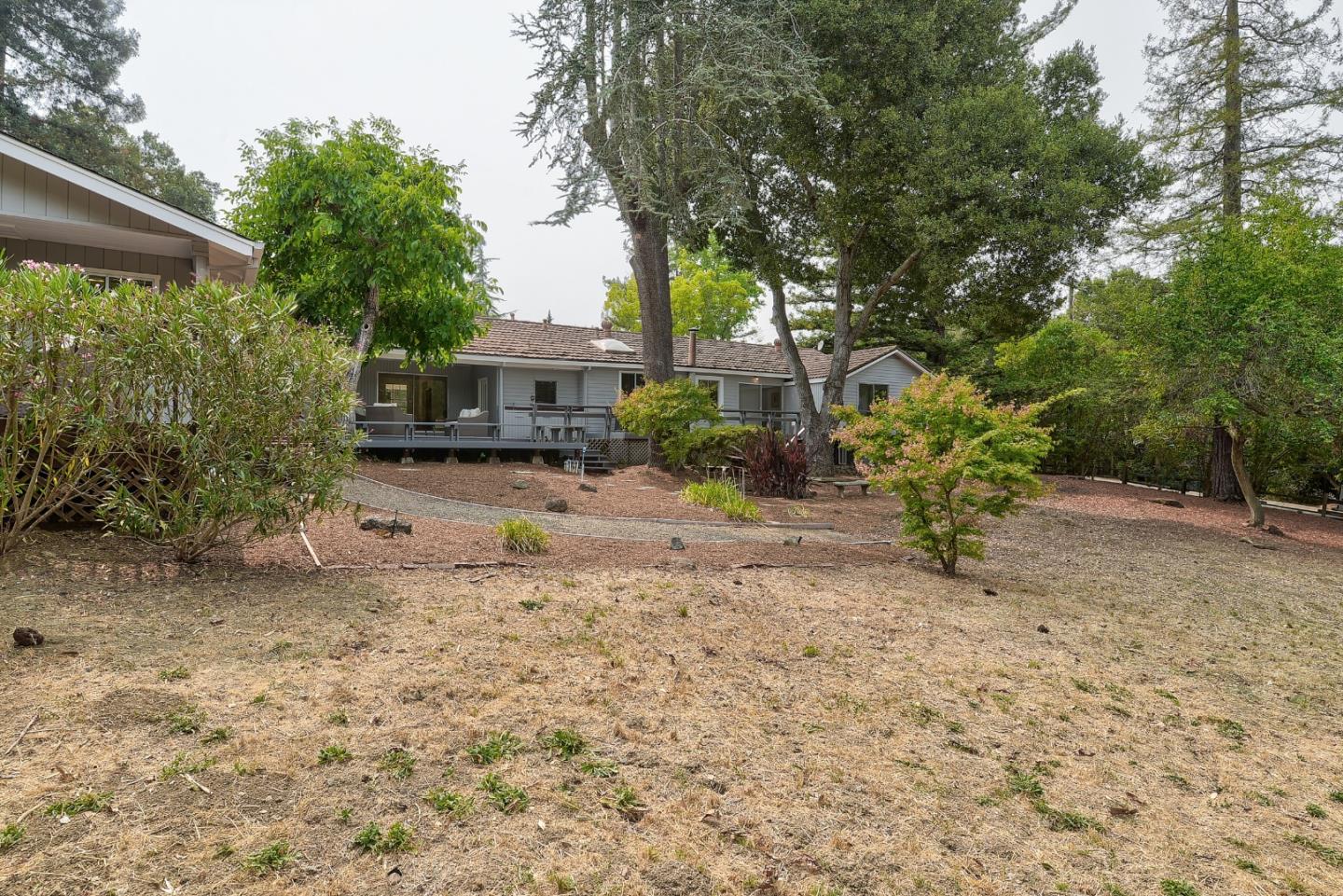 148 Bardet Road Woodside, CA 94062 - Photo 24 of 39 a view of a house with a yard