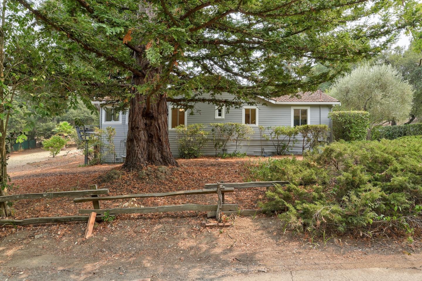 148 Bardet Road Woodside, CA 94062 - Photo 32 of 39 a view of backyard with outdoor seating and trees