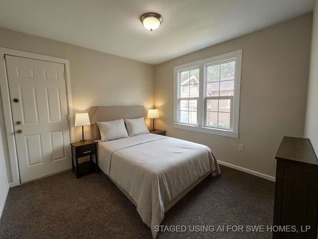 8606 Prairie View Drive Houston, TX 77088 - Photo 13 of 15 a bedroom with a bed and a window