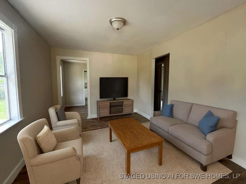 8606 Prairie View Drive Houston, TX 77088 - Photo 4 of 15 a living room with furniture and a flat screen tv