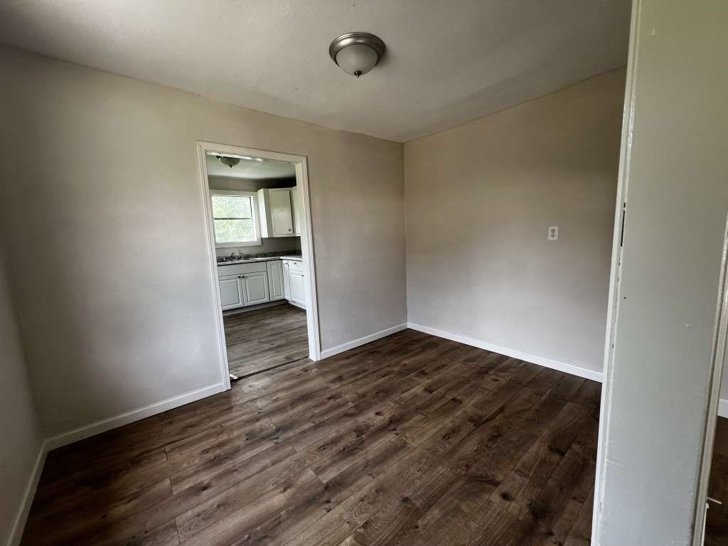 8606 Prairie View Drive Houston, TX 77088 - Photo 5 of 15 a view of empty room with wooden floor
