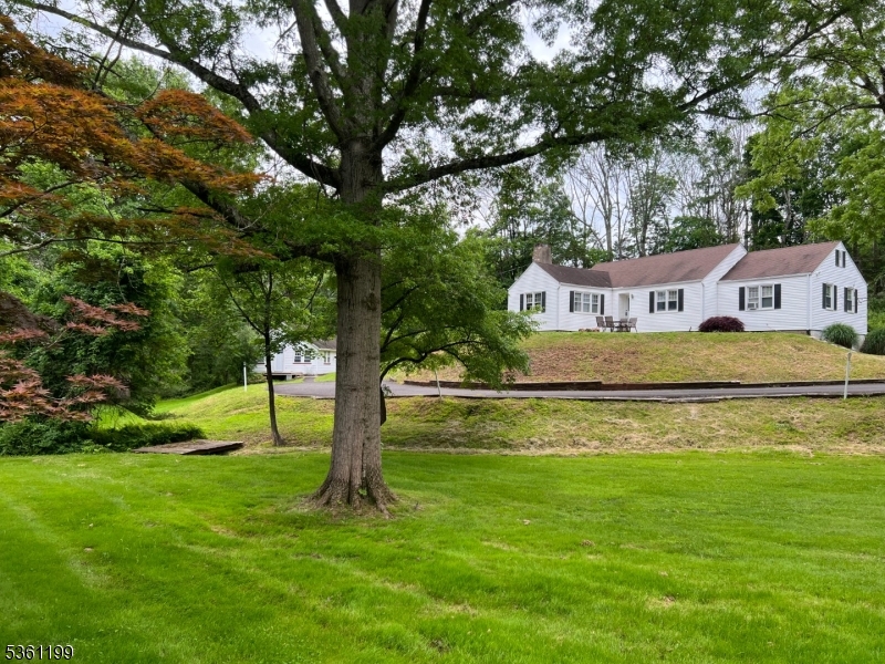 a house view with swimming pool