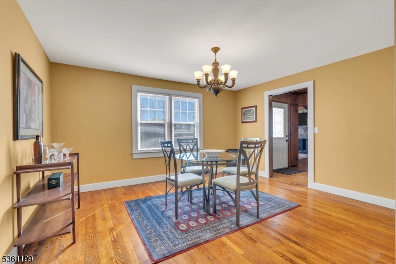 1595 Highway 206 Bedminster, NJ 07921 - Photo 14 of 24 a view of a dining room with furniture and wooden floor