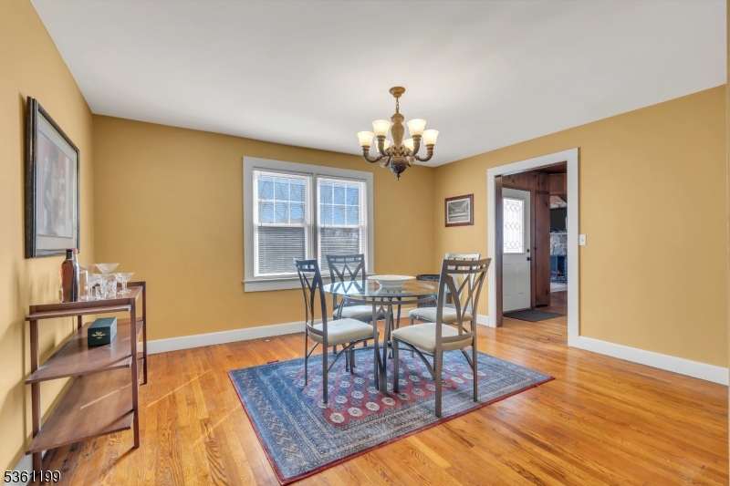 1595 Highway 206 Bedminster, NJ 07921 - Photo 15 of 24 a view of a dining room with furniture and wooden floor