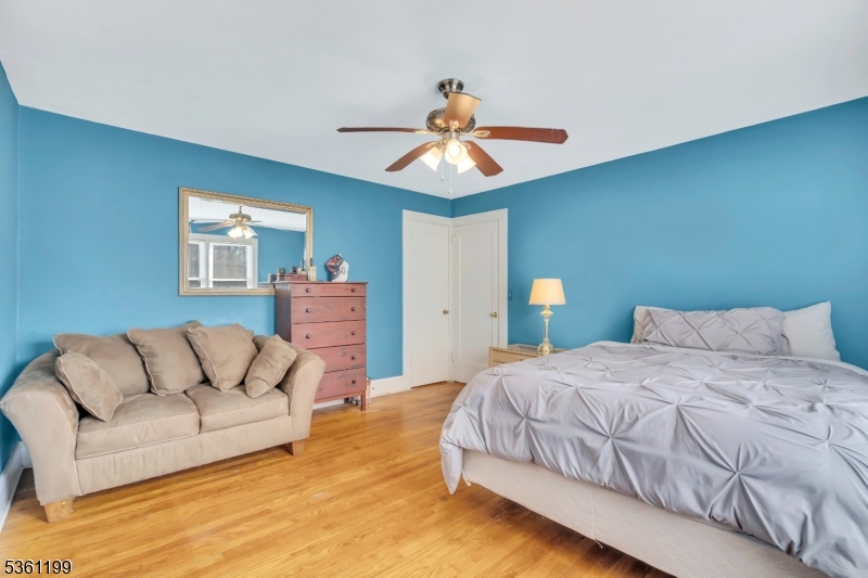 1595 Highway 206 Bedminster, NJ 07921 - Photo 22 of 24 a bedroom with a bed couch and window