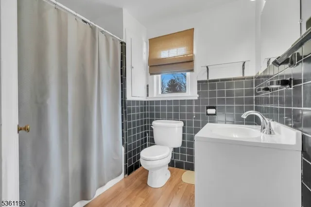 a bathroom with a toilet and a sink