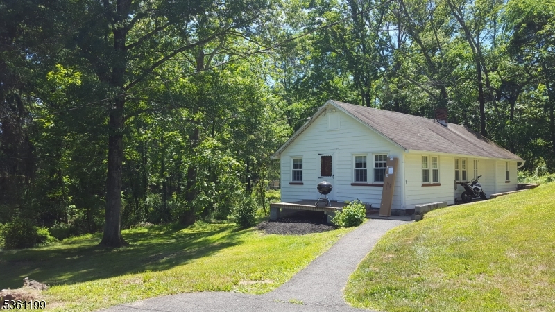 1595 Highway 206 Bedminster, NJ 07921 - Photo 4 of 24 a view of a house with yard and plants